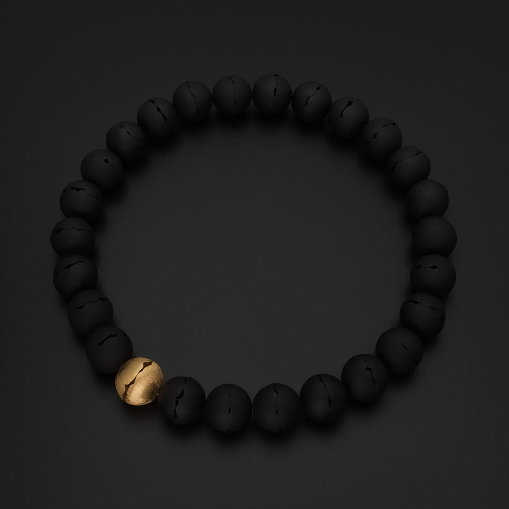 DECO ECHO - Collier med 26 kugler af skaller sort+forgyldt